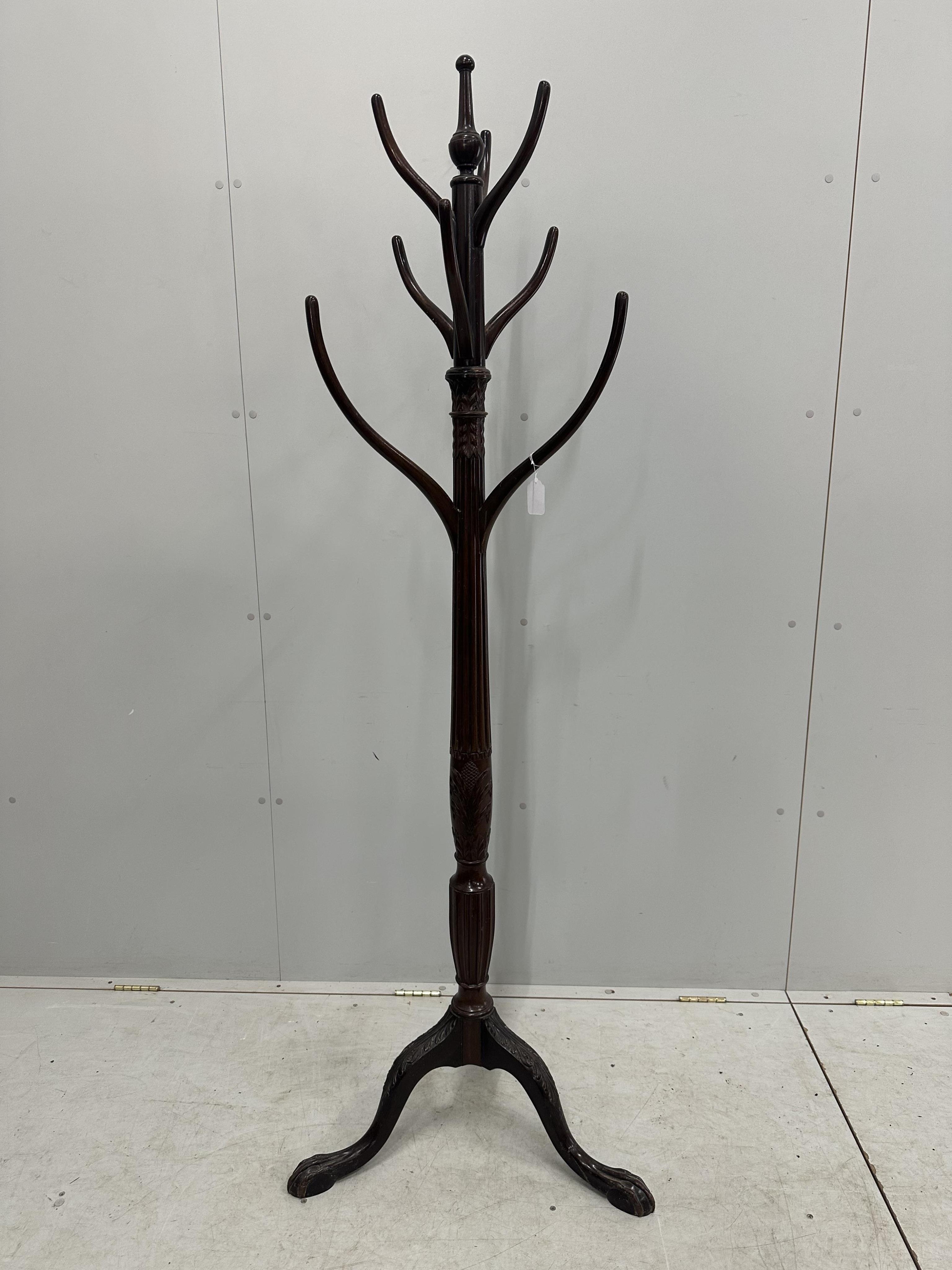 A George III style mahogany coat stand, height 182cm. Condition - fair